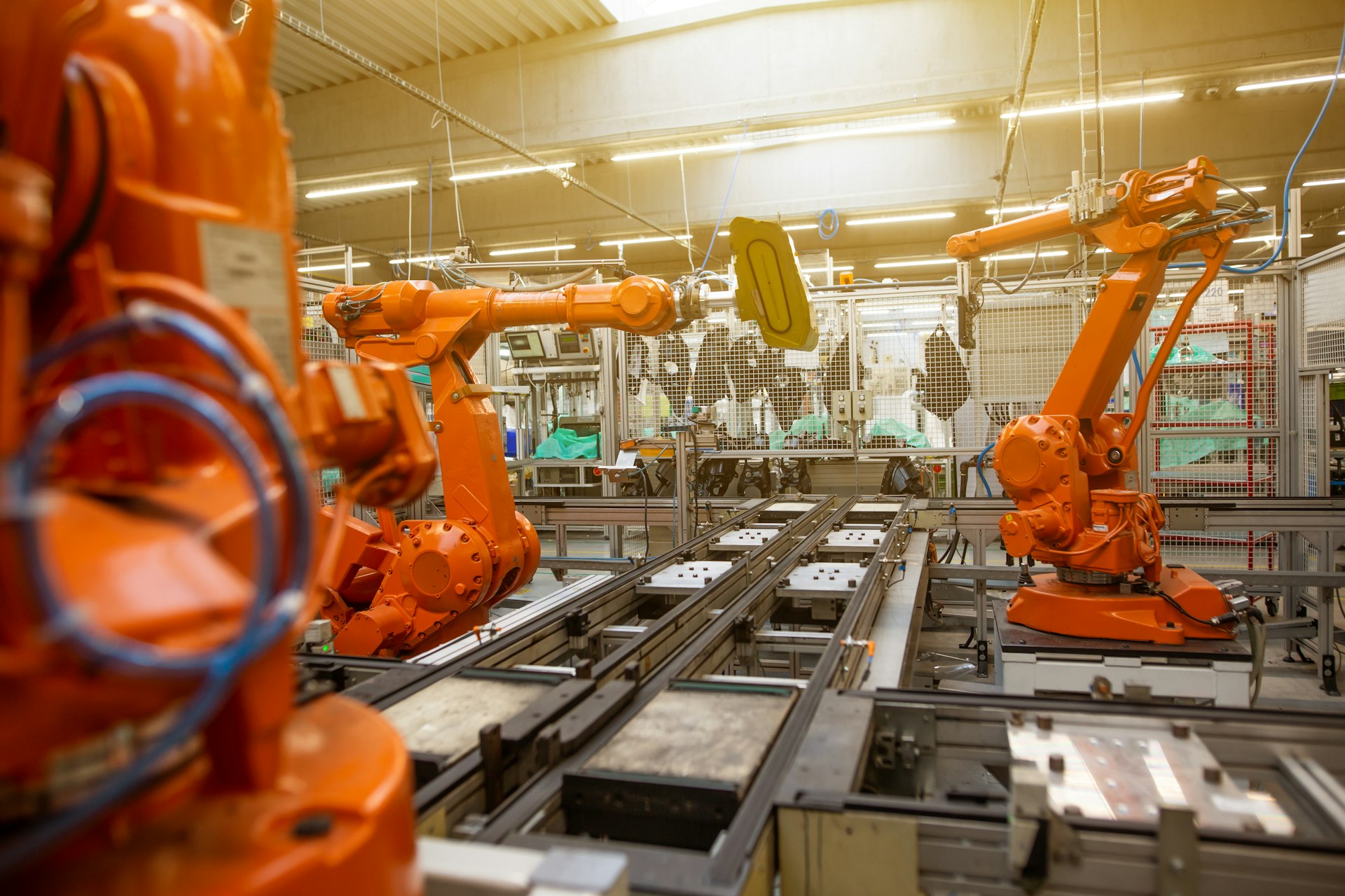 a factory filled with lots of orange machines